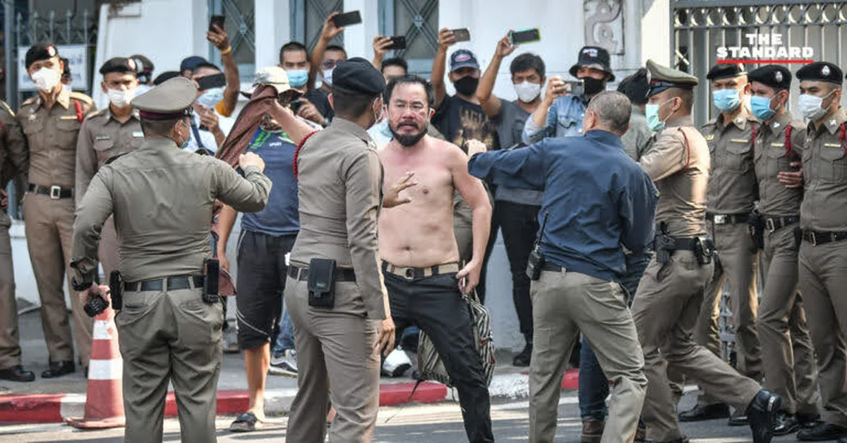 Dr. Boon (Boon Arayapon), founder of the 'Reclaim, Not Beg' movement, standing before Thailand's Government House surrounded by police officers, with the text 'Reclaim Your Own — Not as a Handout'