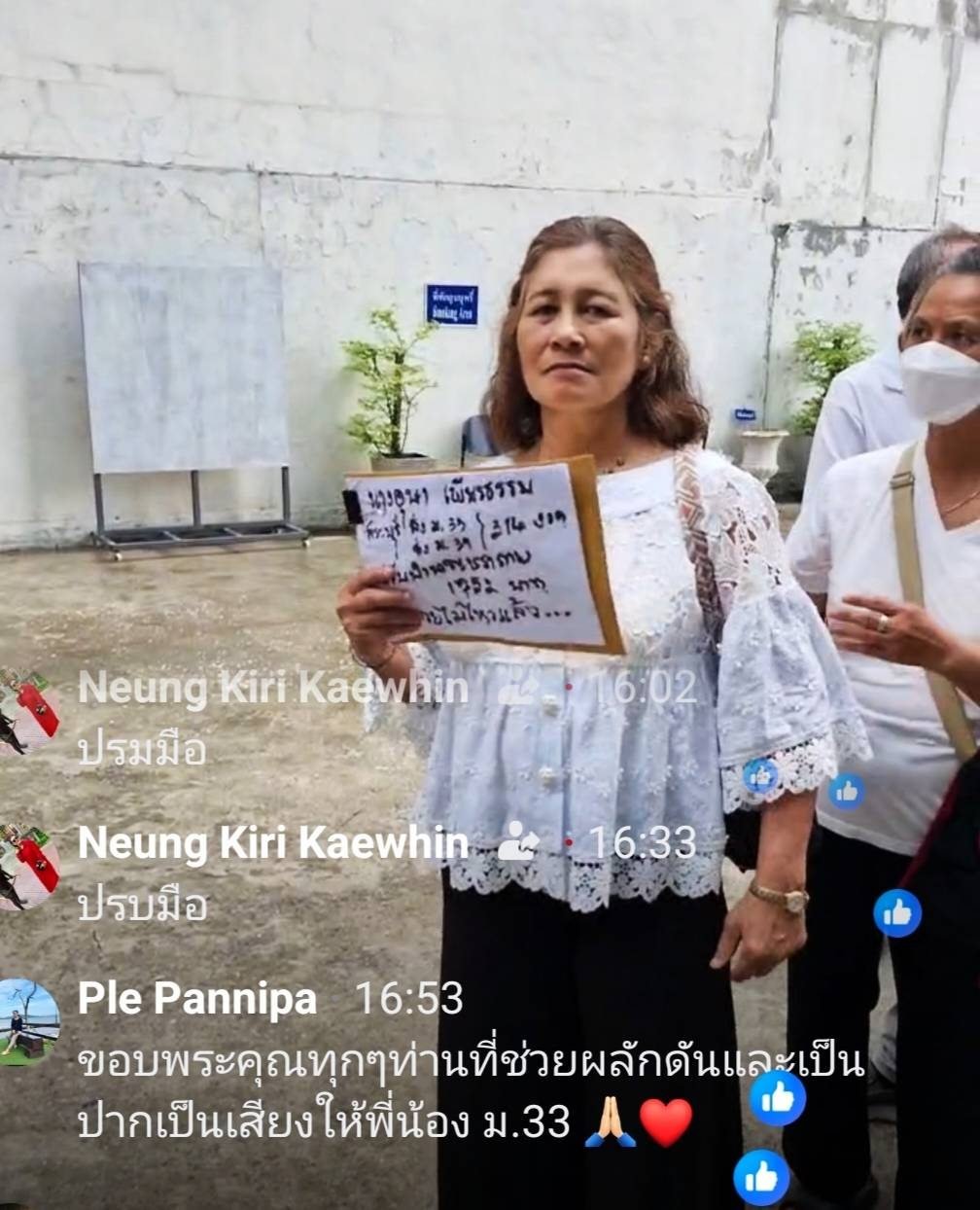 Woman holds sign showing pension 1952 baht with note I cannot take this anymore